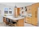 Modern kitchen featuring a center island with seating, custom cabinets and lots of light at 2107 S Grant St, Denver, CO 80210