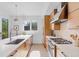 Bright, modern kitchen with stainless steel appliances, stylish countertops, and ample cabinet space at 2107 S Grant St, Denver, CO 80210