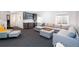 Finished basement with a wet bar, a comfortable sectional sofa, and natural light at 2107 S Grant St, Denver, CO 80210