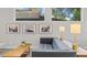 Comfortable living room showcasing a stylish couch, modern lighting, and tasteful wall decor at 2107 S Grant St, Denver, CO 80210