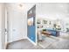 Open-concept living room with modern decor, hardwood floors, and lots of natural light at 2107 S Grant St, Denver, CO 80210