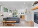 Bright, modern living room with an open floor plan flowing into the dining and kitchen areas at 2107 S Grant St, Denver, CO 80210