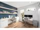 Home office with built-in shelving, wood floors, and an abundance of natural light at 2107 S Grant St, Denver, CO 80210
