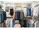 Spacious walk-in closet with ample shelving and hanging space for organized storage at 2107 S Grant St, Denver, CO 80210