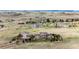 Beautifully landscaped property featuring a two-story home and detached garage on a sprawling lot in a serene neighborhood at 575 Heritage Trl, Elizabeth, CO 80107