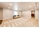 Bright finished basement area with carpeted floors and ample natural light at 575 Heritage Trl, Elizabeth, CO 80107