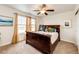 Charming bedroom with wood furnishings, carpet, and ceiling fan at 575 Heritage Trl, Elizabeth, CO 80107