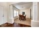 Dining room featuring hardwood floors and bright light from the large window at 575 Heritage Trl, Elizabeth, CO 80107