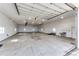 Spacious and well-lit three car garage with high ceilings and ample room for vehicles and storage at 575 Heritage Trl, Elizabeth, CO 80107