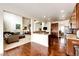 Spacious living room and kitchen featuring hardwood floors, modern appliances, and an open floor plan at 575 Heritage Trl, Elizabeth, CO 80107