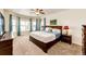 Inviting main bedroom with large windows, soft lighting, and a comfortable king-size bed at 575 Heritage Trl, Elizabeth, CO 80107