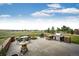 Spacious patio featuring a built-in grill, outdoor seating, a fire pit, and scenic views at 575 Heritage Trl, Elizabeth, CO 80107