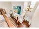 Top-down view of the staircase showcasing the open foyer and chandelier at 575 Heritage Trl, Elizabeth, CO 80107