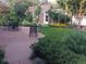 Picturesque backyard featuring a stone patio, manicured lawn, and a charming brick building at 1788 Glencoe St, Denver, CO 80220
