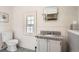 Clean bathroom featuring white tile, granite countertop, and a classic design at 1788 Glencoe St, Denver, CO 80220