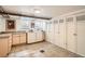 Functional laundry room with washer, dryer, cabinets, and ample storage space at 1788 Glencoe St, Denver, CO 80220