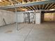 Unfinished basement with concrete floors and exposed ceiling at 6066 Caribou Dr, Brighton, CO 80601