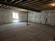Unfinished basement with concrete floors and exposed ceiling at 6066 Caribou Dr, Brighton, CO 80601