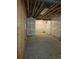 Unfinished basement with concrete floors and exposed ceiling at 6066 Caribou Dr, Brighton, CO 80601