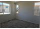 Bright bedroom with large windows and carpet flooring at 6066 Caribou Dr, Brighton, CO 80601