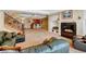 Spacious finished basement with a fireplace, bar, and comfortable seating area at 9298 Spirit Ct, Parker, CO 80138