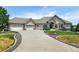 Stunning home with a three-car garage, landscaped front yard, and a long driveway at 9298 Spirit Ct, Parker, CO 80138