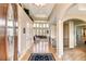 Grand foyer with hardwood floors, soaring ceilings, and decorative lighting fixtures at 9298 Spirit Ct, Parker, CO 80138