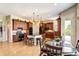 Kitchen with island, granite counters, stainless appliances, wooden cabinets, and breakfast nook at 9298 Spirit Ct, Parker, CO 80138