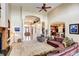 Spacious living room with high ceilings, archways, and open floor plan to the kitchen and entryway at 9298 Spirit Ct, Parker, CO 80138