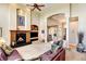 Inviting living room with soaring ceilings, fireplace, built-ins, and large windows for natural light at 9298 Spirit Ct, Parker, CO 80138