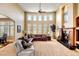Spacious living room featuring a fireplace, high ceilings, and ample natural light at 9298 Spirit Ct, Parker, CO 80138