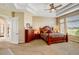 Spacious main bedroom features a tray ceiling, ceiling fan, and large windows with a lovely view at 9298 Spirit Ct, Parker, CO 80138