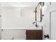 Finished bathroom features granite vanity, modern mirror, and neutral paint at 1620 Dahlia St, Denver, CO 80220