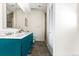 Full bathroom featuring a double vanity, neutral walls, and tiled flooring at 1620 Dahlia St, Denver, CO 80220