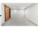 Bright bedroom with wood sliding door, neutral walls, and carpet flooring at 1620 Dahlia St, Denver, CO 80220