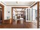 Spacious living area featuring hardwood floors, wood trim, and open doorway at 1620 Dahlia St, Denver, CO 80220