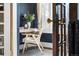 Charming sun room featuring hardwood floors, a writing desk, and large windows, providing natural light and a pleasant workspace at 1620 Dahlia St, Denver, CO 80220