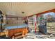 Backyard patio featuring a hot tub, grill, wooden trellis, and fenced yard at 13294 W 65Th Dr, Arvada, CO 80004