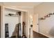 Bedroom storage closet featuring an open door with boxes, shelves, and hanging space at 13294 W 65Th Dr, Arvada, CO 80004