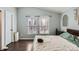 Bedroom boasts soothing paint, two large windows, and stylish decorations at 13294 W 65Th Dr, Arvada, CO 80004