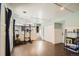 Spacious bonus room features wood floors, drop ceiling, and access to the upper level at 13294 W 65Th Dr, Arvada, CO 80004
