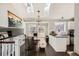 Bright dining area with skylights, modern lighting, and wood floors at 13294 W 65Th Dr, Arvada, CO 80004