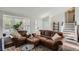 Cozy living room with comfortable seating, natural light, and stylish decor at 13294 W 65Th Dr, Arvada, CO 80004