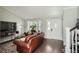 Elegant living room showcasing hardwood floors, large windows, and a welcoming atmosphere at 13294 W 65Th Dr, Arvada, CO 80004