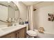 Well-lit bathroom featuring a modern vanity, updated fixtures, and a shower-tub combination at 10610 Moore Ct, Westminster, CO 80021