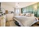 Cozy bedroom with a comfortable bed, accent wall, and large window for natural light at 10610 Moore Ct, Westminster, CO 80021