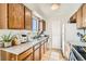Functional kitchen with light wood cabinets, ample counter space, and modern appliances at 10610 Moore Ct, Westminster, CO 80021