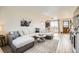 Open-concept living room features stylish decor, comfortable seating, and bright natural light at 10610 Moore Ct, Westminster, CO 80021