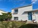 Charming two-story home with blue front door and flower boxes under the window at 10610 Moore Ct, Westminster, CO 80021