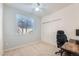 The room offers natural light through a window with a plush computer chair and slider closet at 803 E 98Th Ave # 105, Thornton, CO 80229